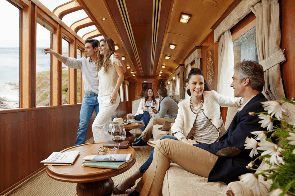 Passengers enjoying luxury accommodations and scenic views aboard El Transcantabrico Gran Lujo train